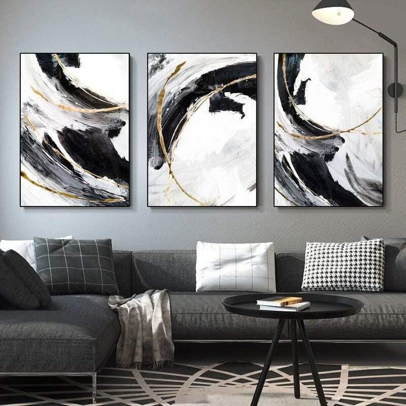 Set of 3 modern abstract wall art canvas prints by 5th Color featuring black, white, and gold minimalist luxury home decor.
