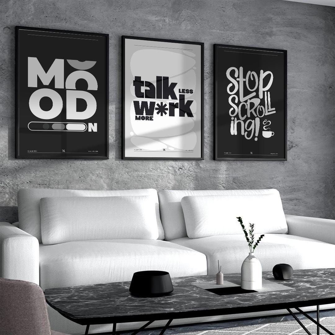 Set of 3 black and white typography posters from 5th Color, modern wall art with bold text designs displayed on a wall.